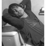 Anthony Kiedis black & white photo of him leaning back on a toilet