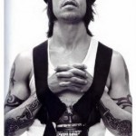 Anthony Kiedis black & white photo of him with arms inside chest