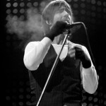 Anthony Kiedis black & white photo of him smoking on stage