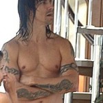 topless Anthony Kiedis tattoo arm bands and tribal dagger tattoos