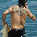 Anthony Kiedis back tattoo eagle falcon Inca tribal native American design getting out of pool