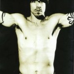 Anthony Kiedis black & white topless with arms outstretched