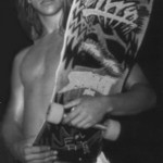 Anthony Kiedis black & white photo of him holding a skateboard