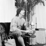 Anthony Kiedis black & white photo of him at table