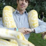 Anthony Kiedis with an albino python snke