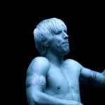 Anthony Kiedis topless in a blue light