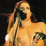 Anthony Kiedis topless on stage holding glass