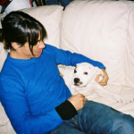 Anthony Kiedis with a white dog