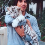 Anthony Kiedis with a white tiger cub